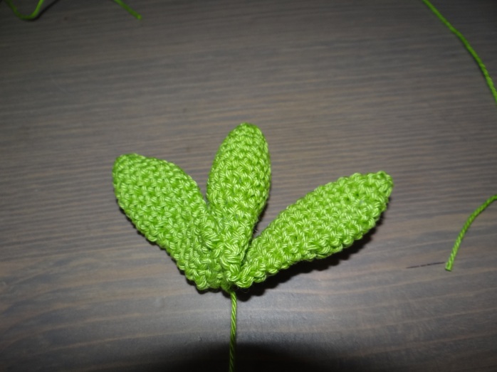 Sew the unstuffed leaves around the stuffed one to make a bundle